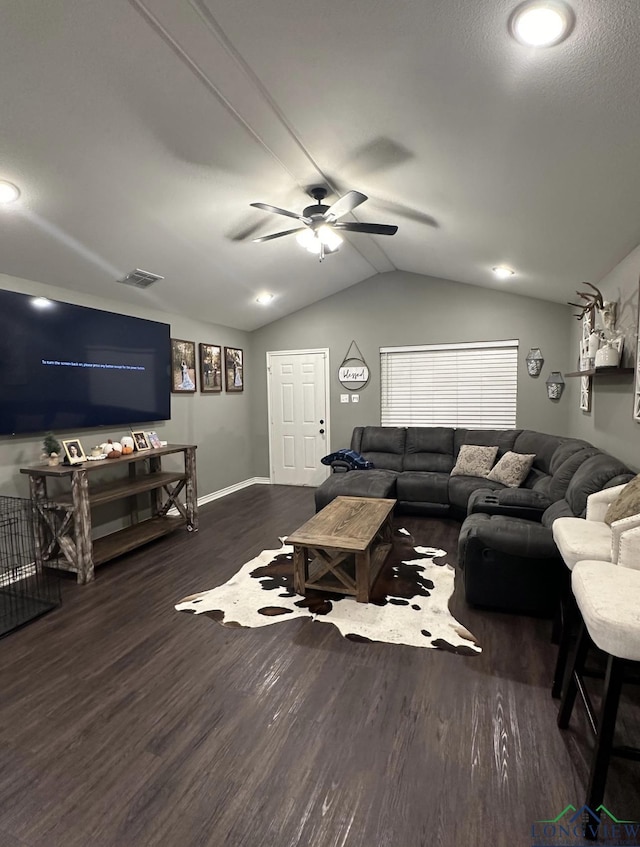 living room with ceiling fan, lofted ceiling, and dark hardwood / wood-style floors