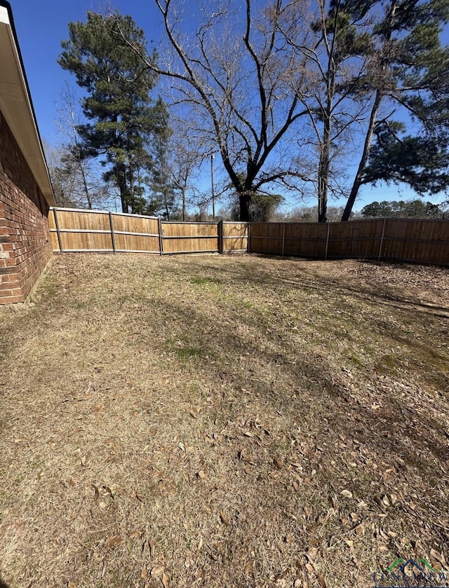 view of yard with a fenced backyard