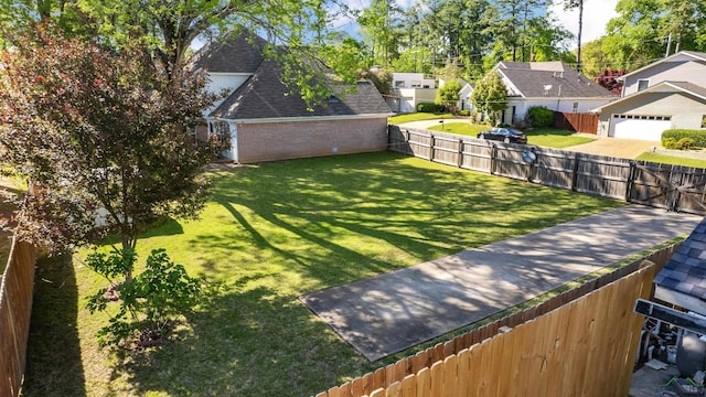 view of yard with a residential view and a fenced backyard