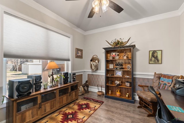 office space with baseboards, wood finished floors, a ceiling fan, and ornamental molding