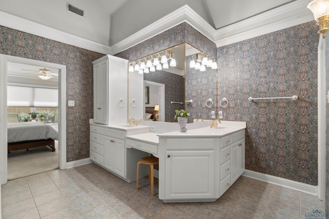 ensuite bathroom featuring wallpapered walls, visible vents, ensuite bathroom, and a sink