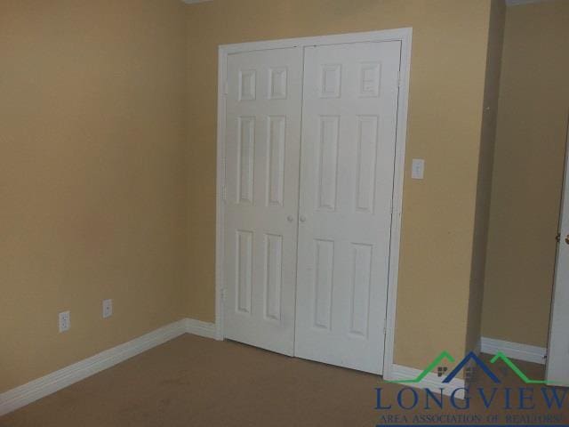 unfurnished bedroom with a closet