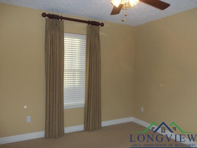 spare room featuring ceiling fan