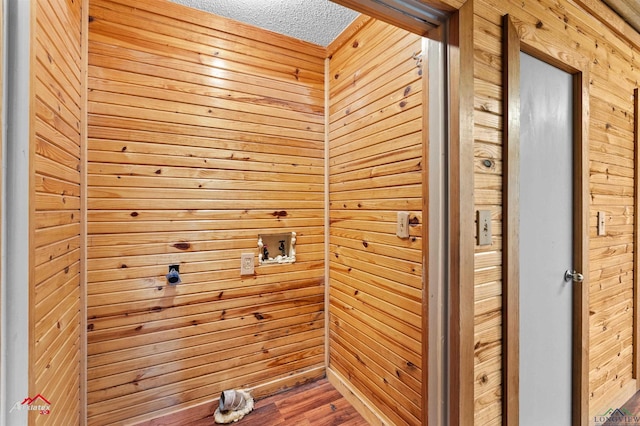 washroom featuring a textured ceiling and hookup for a washing machine