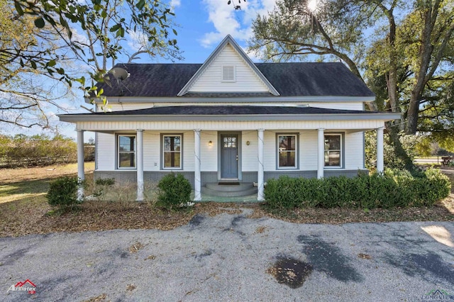 farmhouse inspired home featuring a porch