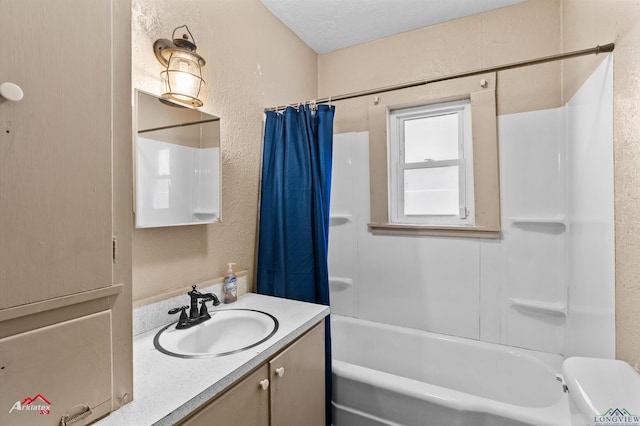 full bathroom with shower / bath combo with shower curtain, vanity, a textured ceiling, and toilet