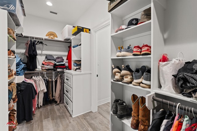 spacious closet featuring visible vents and light wood-style floors