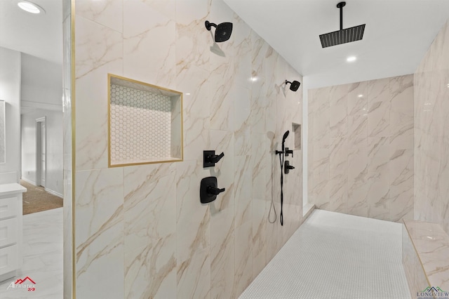 bathroom featuring a marble finish shower and recessed lighting