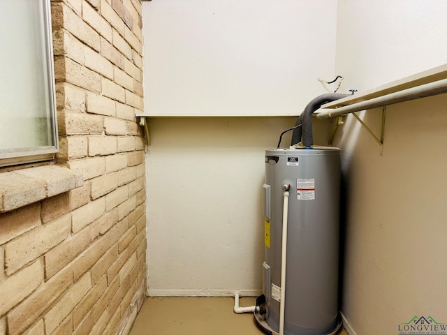 utility room featuring electric water heater