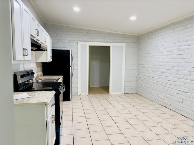 kitchen with white cabinetry, stainless steel electric stove, crown molding, and brick wall