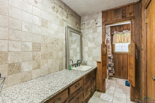 bathroom with vanity and a textured ceiling