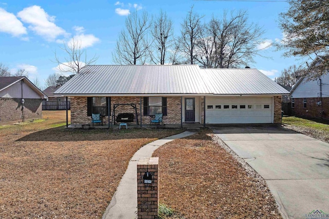 ranch-style home featuring a garage and a porch