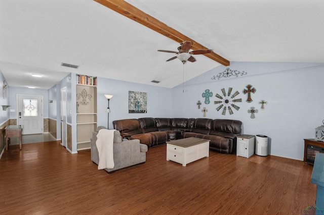 living room with dark wood-type flooring, ceiling fan, and vaulted ceiling with beams