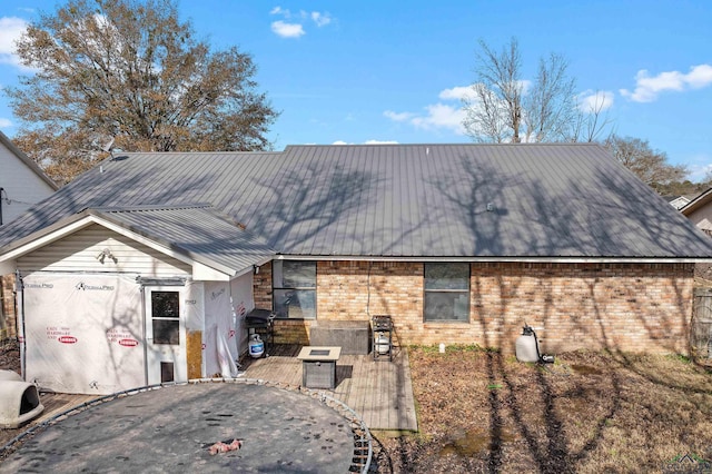 rear view of property with a deck