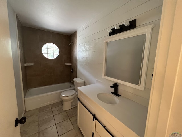 bathroom with toilet, tile patterned floors,  shower combination, and vanity