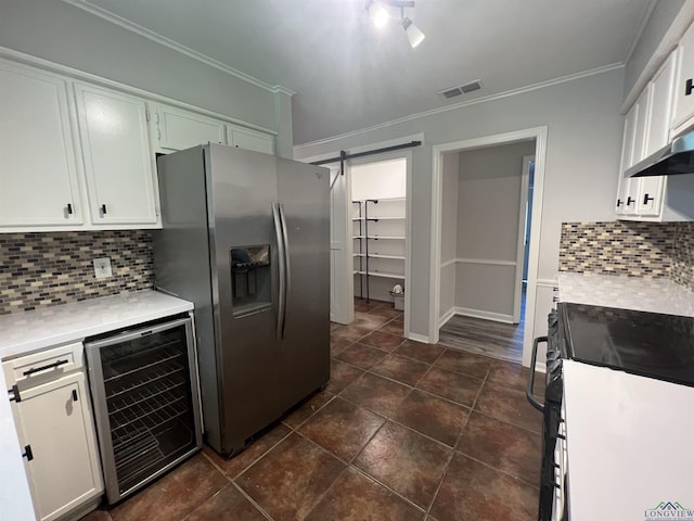 kitchen featuring wine cooler, a barn door, black / electric stove, visible vents, and stainless steel fridge with ice dispenser