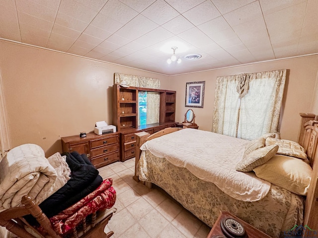 bedroom featuring visible vents and light tile patterned floors