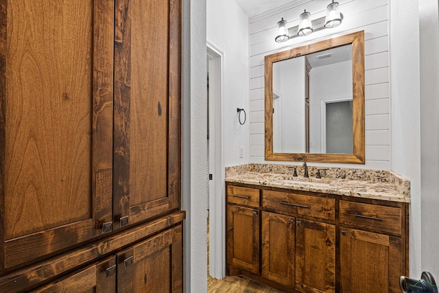 bathroom featuring hardwood / wood-style flooring and vanity