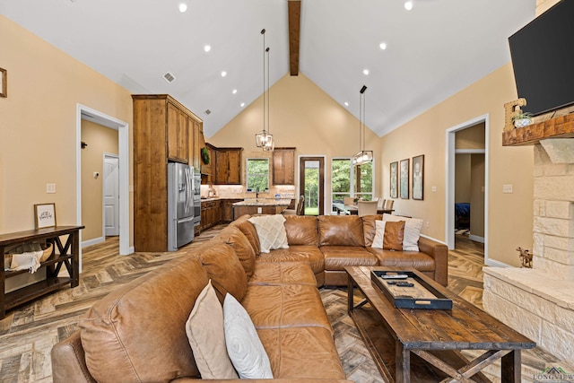 living room featuring dark parquet flooring, high vaulted ceiling, and beam ceiling