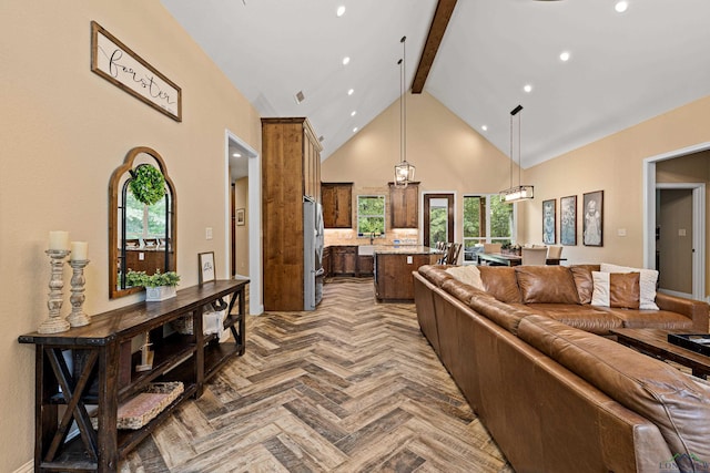 living room with beam ceiling, an inviting chandelier, high vaulted ceiling, and parquet floors