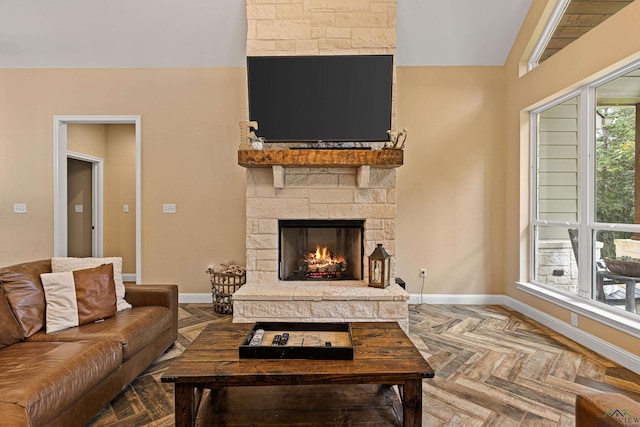 living room featuring parquet floors and a fireplace