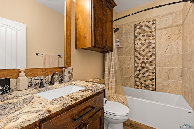 full bathroom with shower / bath combo, toilet, and vanity