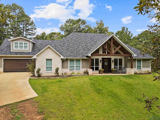 craftsman inspired home featuring a porch, a garage, and a front yard