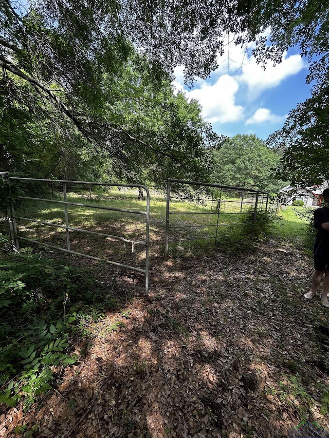 view of yard featuring a gate and fence