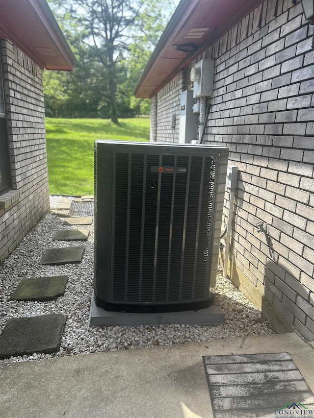 details with brick siding and cooling unit