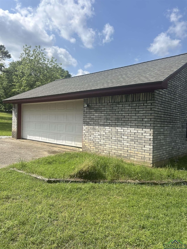 garage featuring driveway