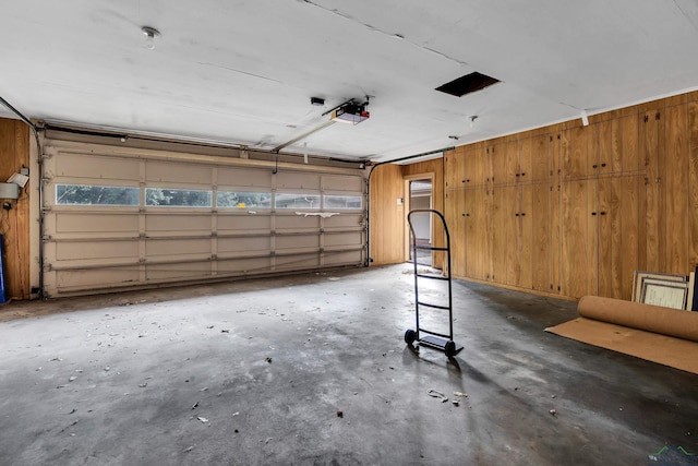 15 Covington Dr, Longview, TX 75602 - garage with wood walls and a garage door opener