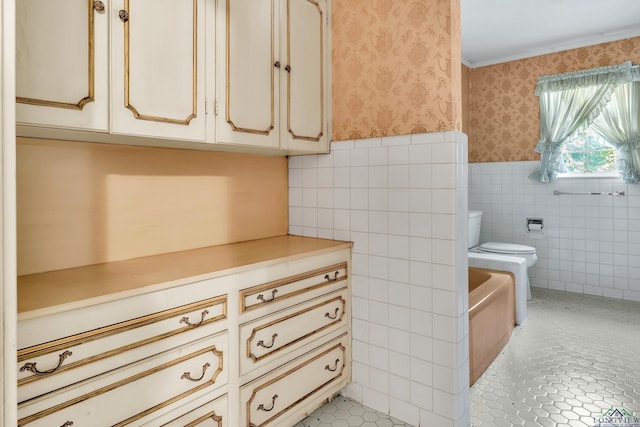 15 Covington Dr, Longview, TX 75602 - full bathroom featuring wallpapered walls, tile walls, wainscoting, crown molding, and a tub