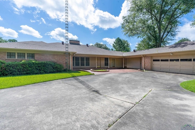 15 Covington Dr, Longview, TX 75602 - ranch-style house featuring concrete driveway, brick siding, and a garage