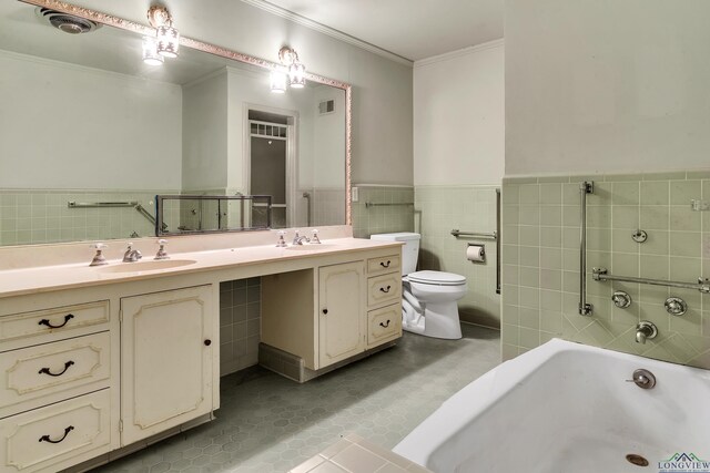 15 Covington Dr, Longview, TX 75602 - bathroom featuring vanity, ornamental molding, tile walls, a bathtub, and tile patterned flooring