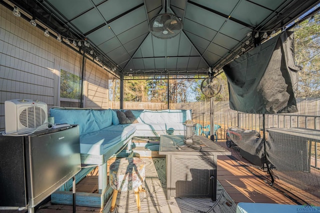 wooden deck featuring fence and an outdoor living space