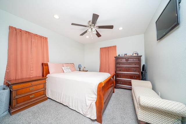 bedroom with light carpet, ceiling fan, and recessed lighting