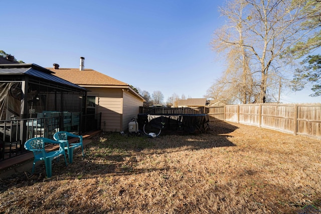 view of yard with a fenced backyard and a gazebo