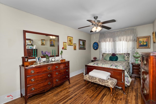 bedroom with dark hardwood / wood-style flooring and ceiling fan