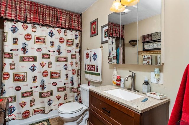 bathroom featuring tile patterned flooring, a shower with curtain, vanity, and toilet