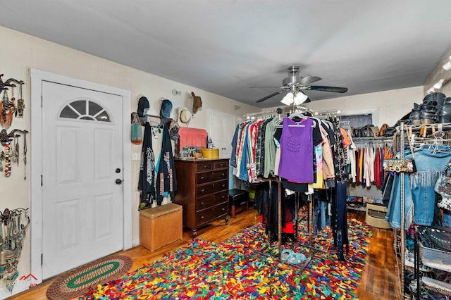 spacious closet with hardwood / wood-style floors and ceiling fan