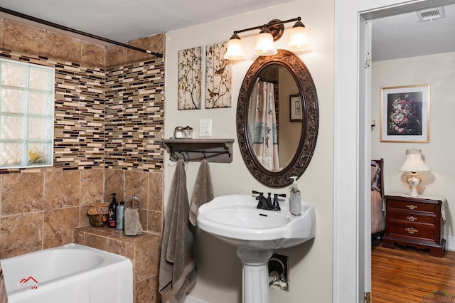 bathroom with a tub