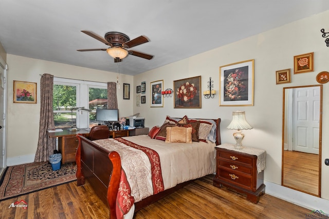 bedroom featuring ceiling fan and dark wood-type flooring