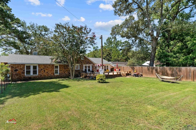 view of yard with a deck