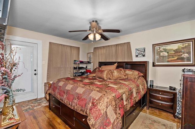 bedroom with ceiling fan and light hardwood / wood-style flooring