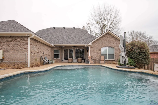 view of pool featuring ceiling fan and a patio area