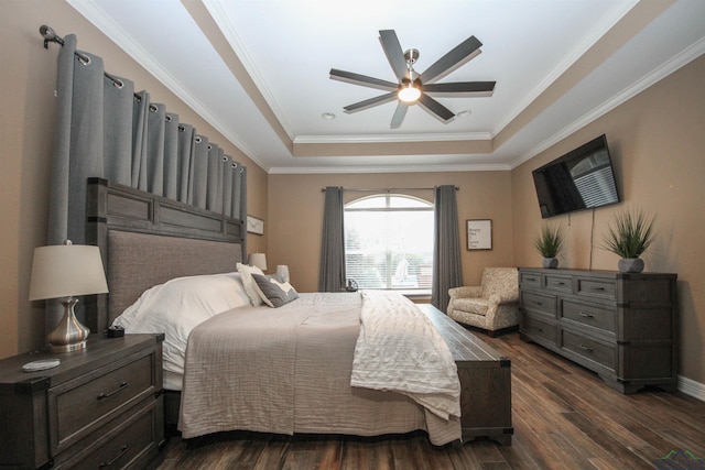 bedroom featuring a raised ceiling, crown molding, ceiling fan, and dark hardwood / wood-style flooring