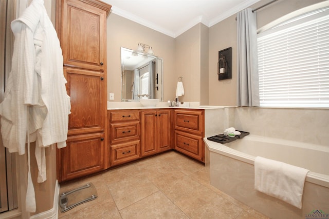 bathroom with crown molding, vanity, tile patterned flooring, and a bathtub