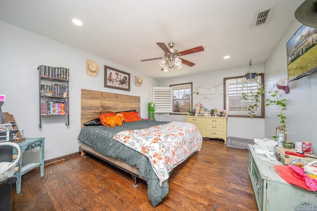 bedroom with visible vents, wood finished floors, and recessed lighting