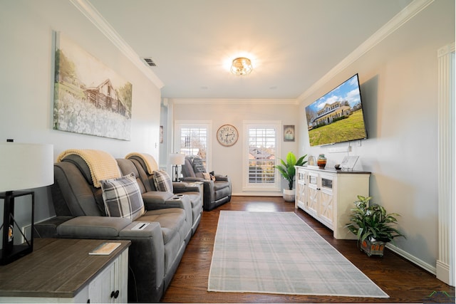 living area with dark wood-style floors, visible vents, and ornamental molding