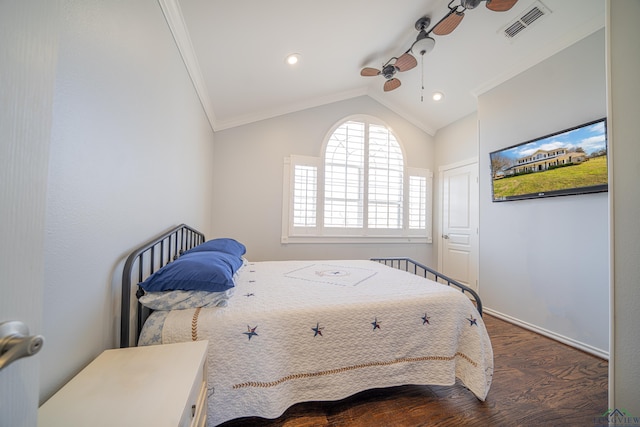 bedroom featuring dark wood-style floors, lofted ceiling, visible vents, and crown molding